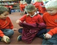 Y1 explore the contents of the mystery bag